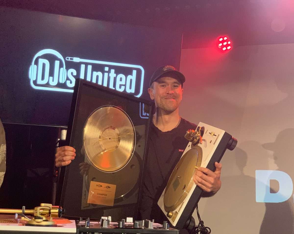 DJ Patty B holding his Australian DMC Gold Record trophy and Technics turntable prize